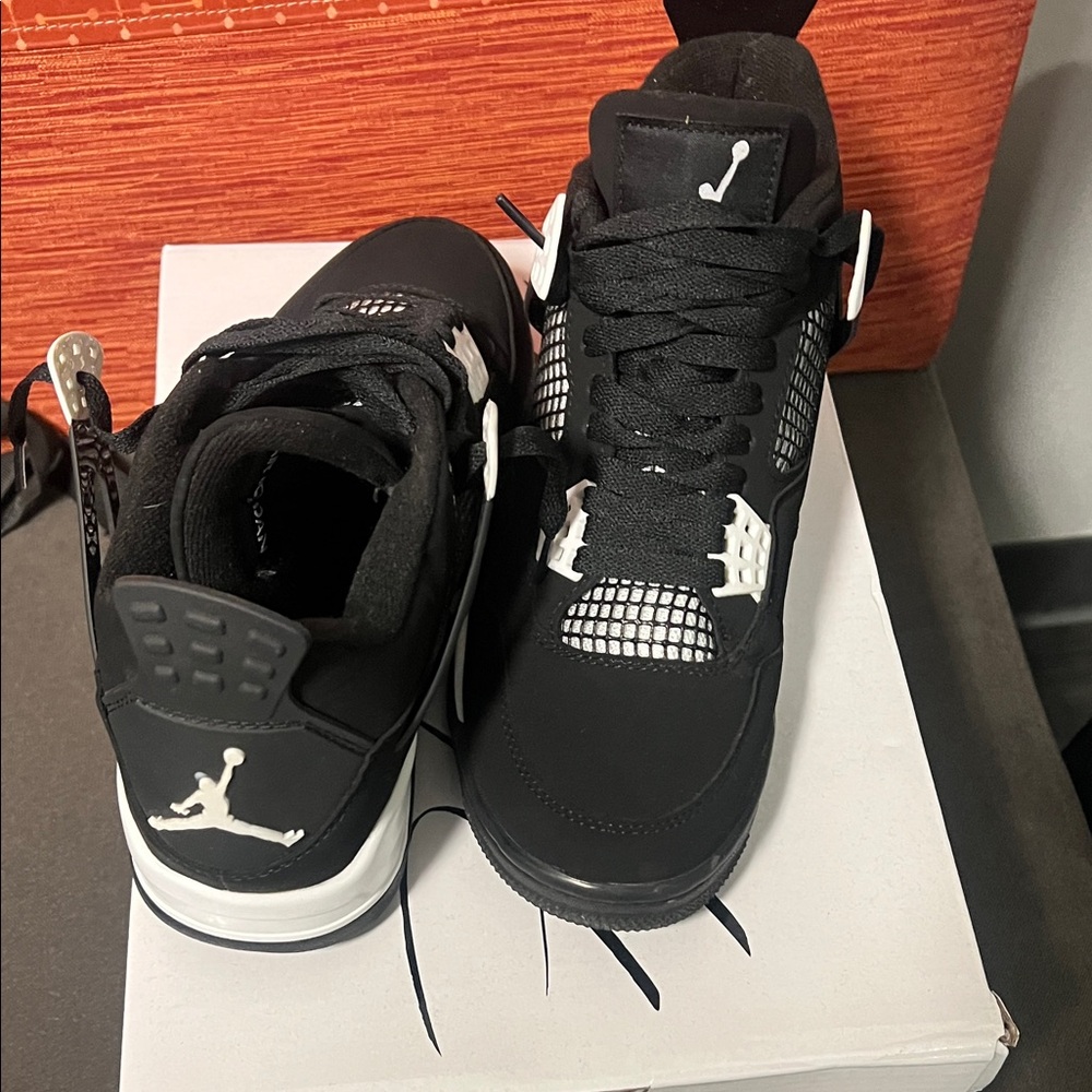 Black and White Jordan 4s
